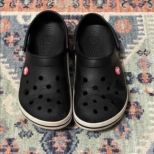CROCS Black Clogs with White Trim and Red Logo Accent
